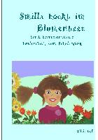 Smilla hockt im Blumenbeet