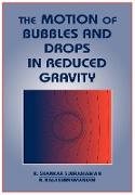 The Motion of Bubbles and Drops in Reduced Gravity