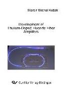 Development of Thulium-Doped Fluoride Fiber Amplifiers