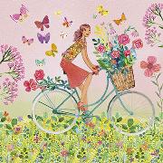 Postkarte. Frau auf Fahrrad